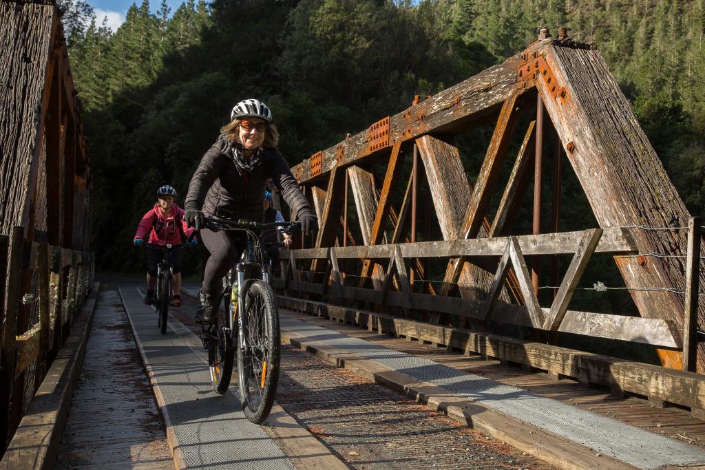 Riding the truss bridge on Remutaka Cycle Trail