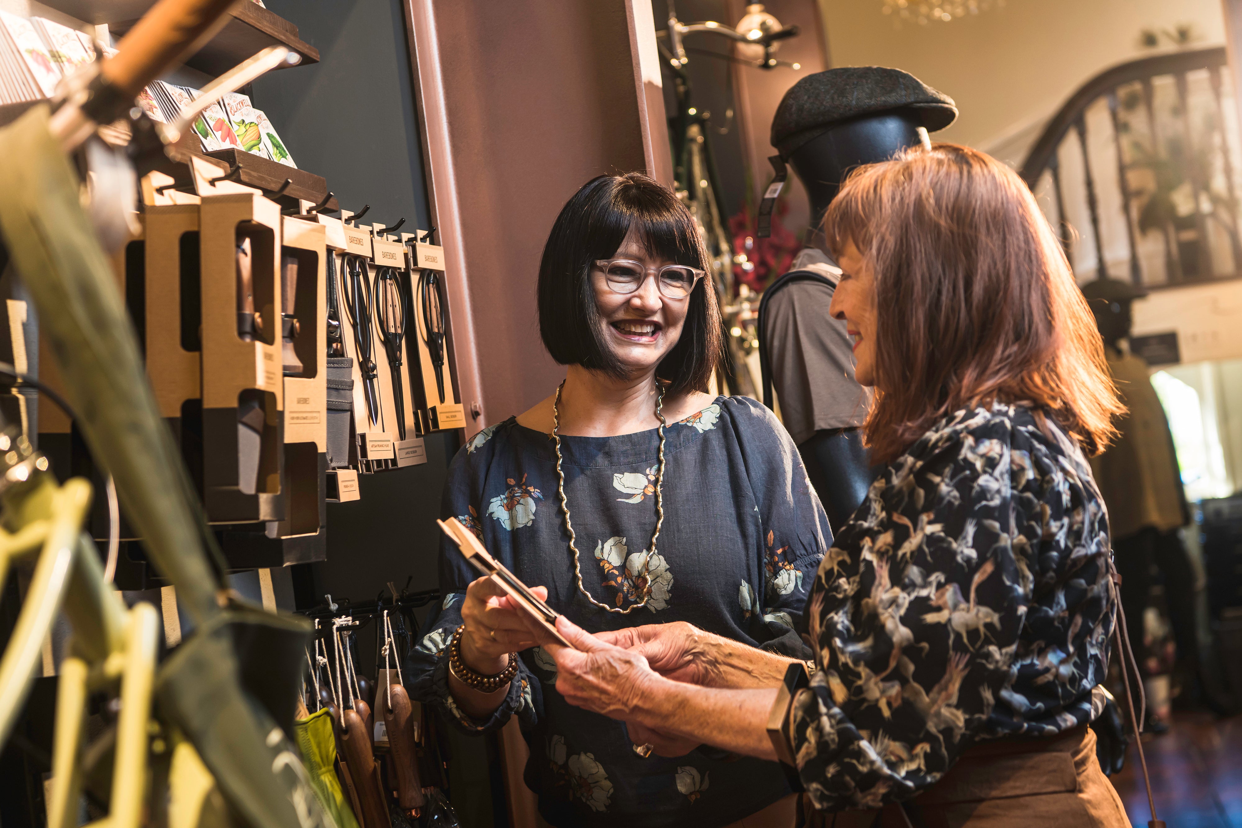 Ladies looking at products inside shop 