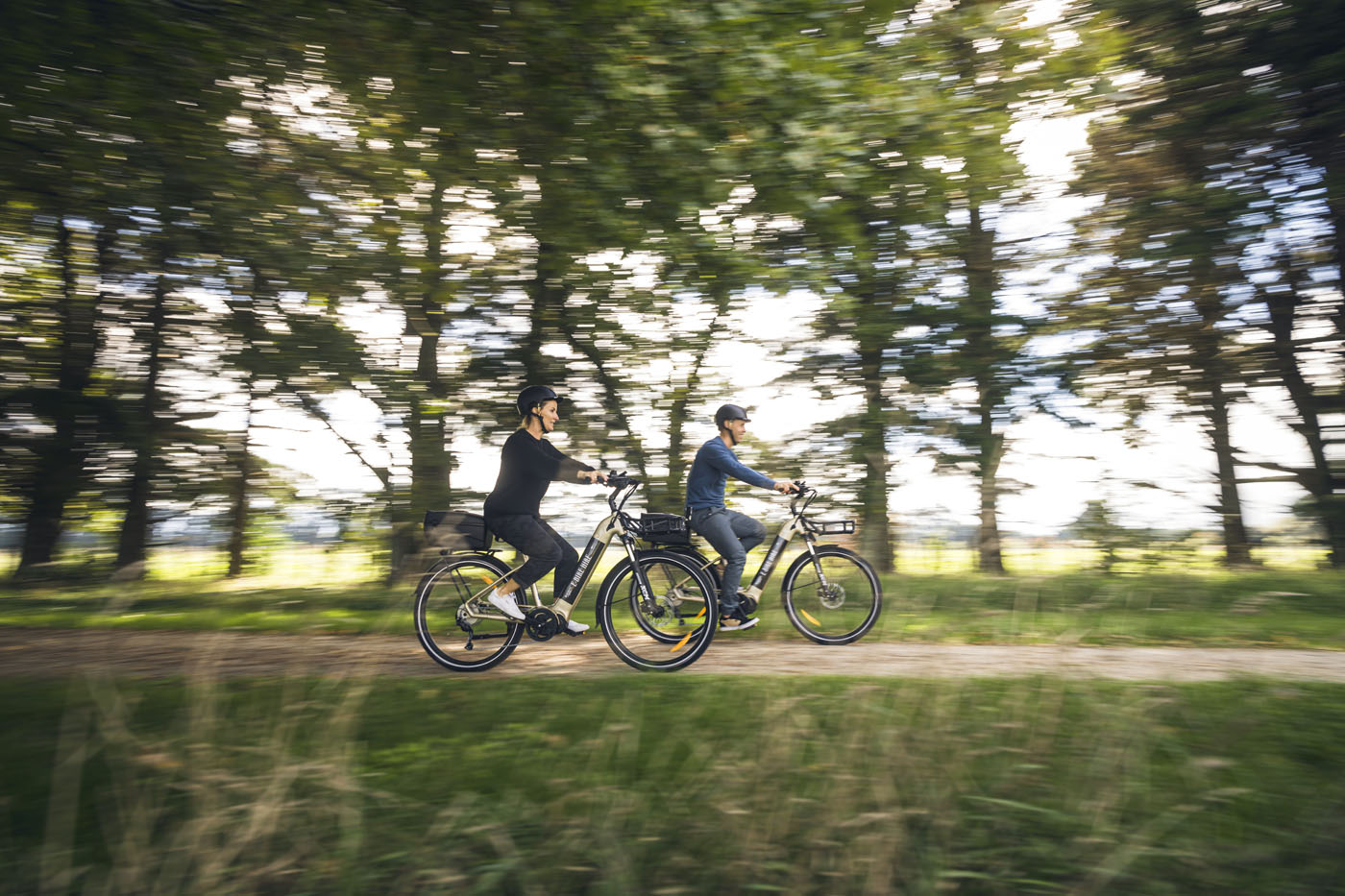 People cycling on a country road 