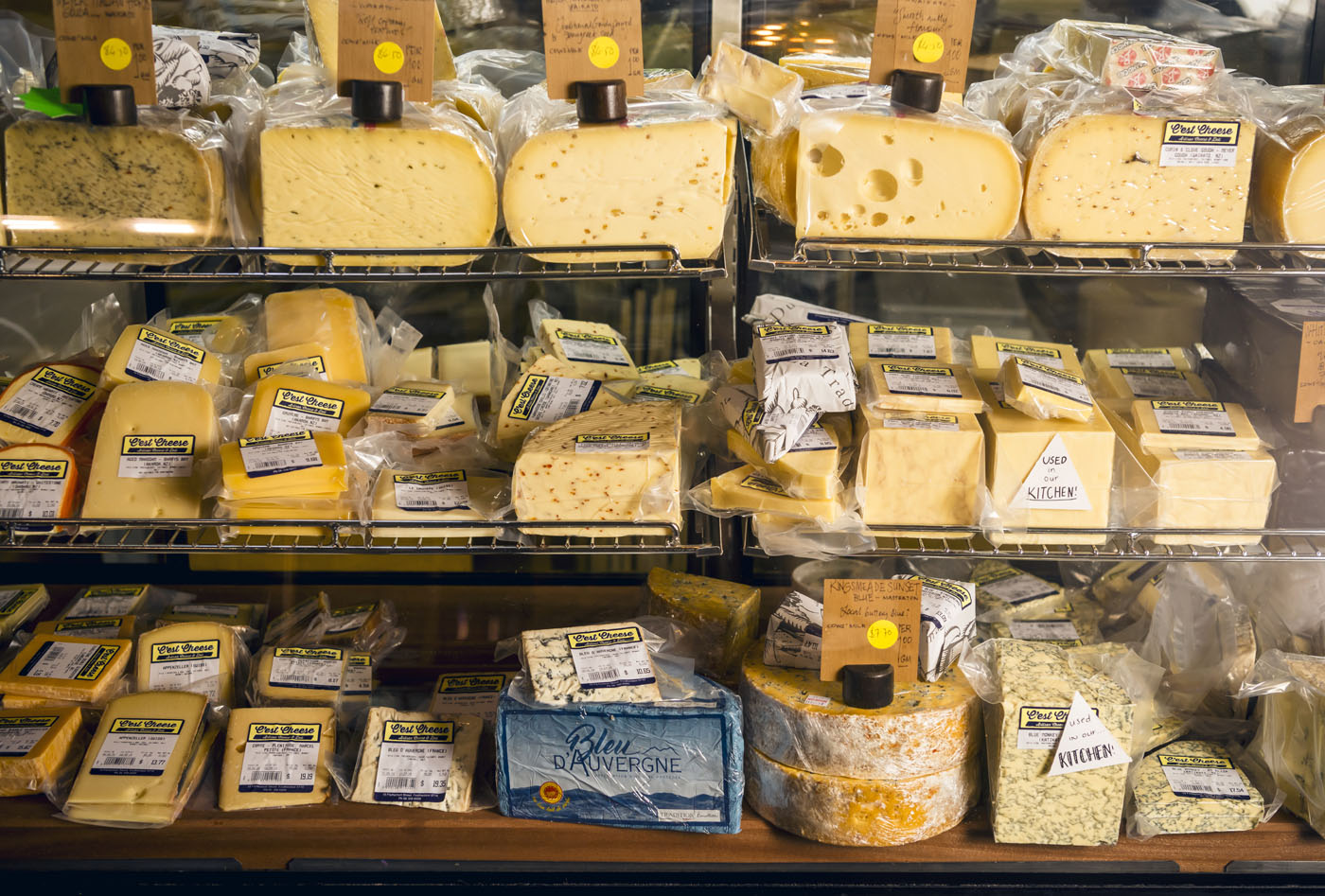 Rows of cheese on display