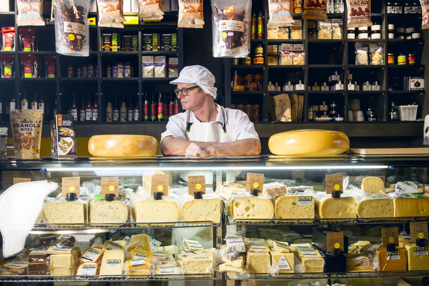 The cheesemaker behind the display counter