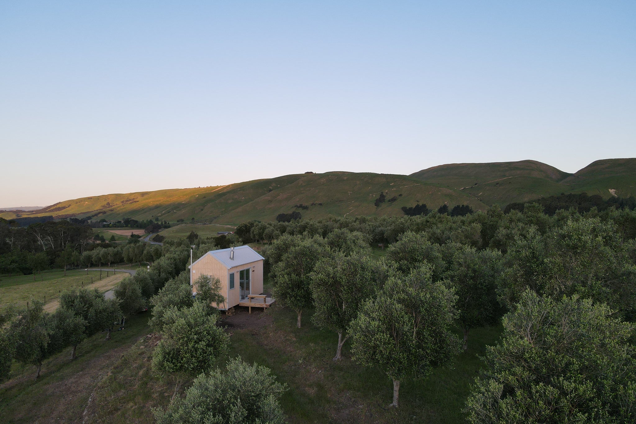 Cabin nestled in the Blue Earth Estate olive grove.