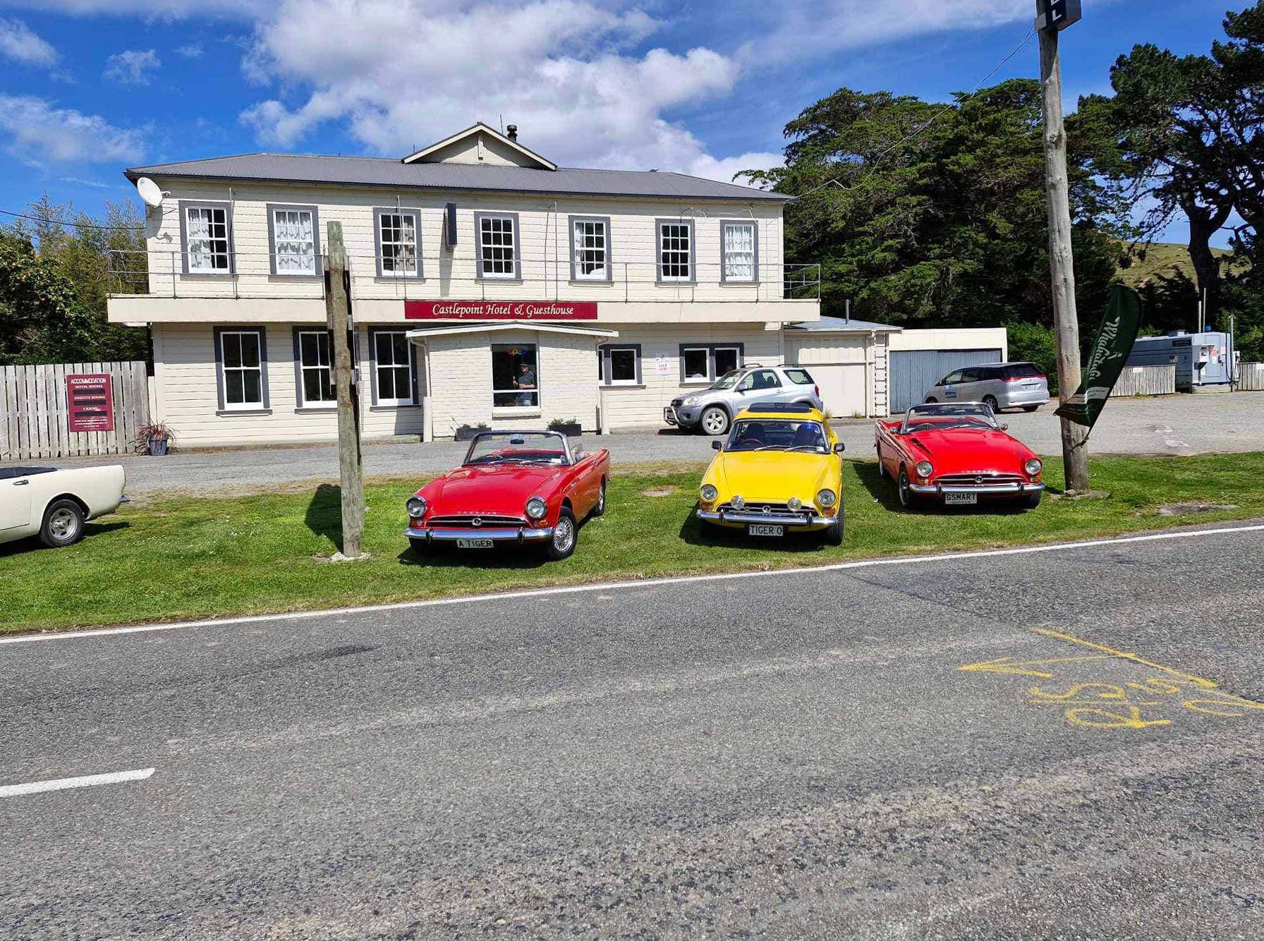 Classic cars lined up outside country pub