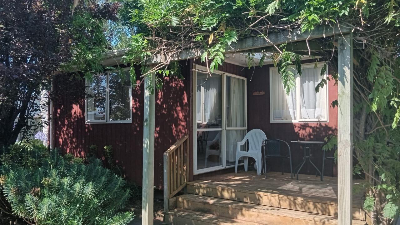 Front Deck facing side of private garden. All day sun.