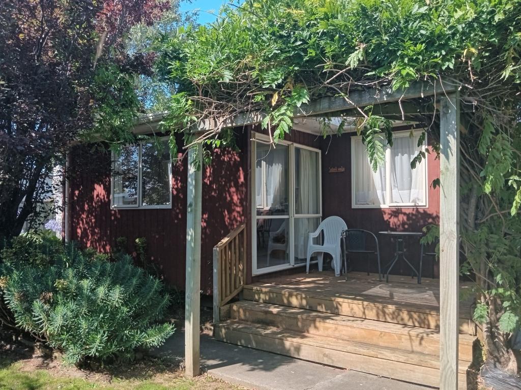 Front Deck facing side of private garden. All day sun.