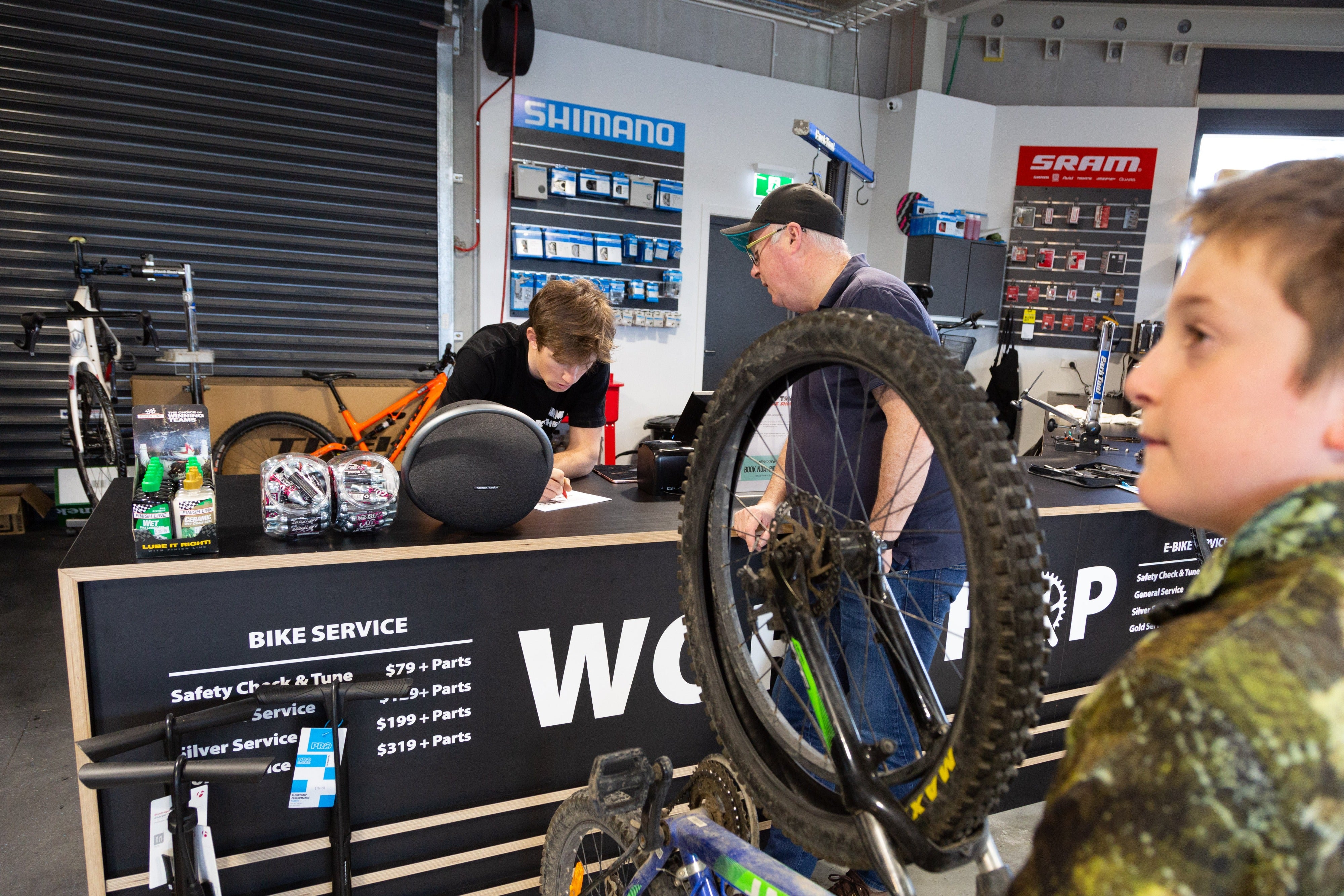 People at bike service counter