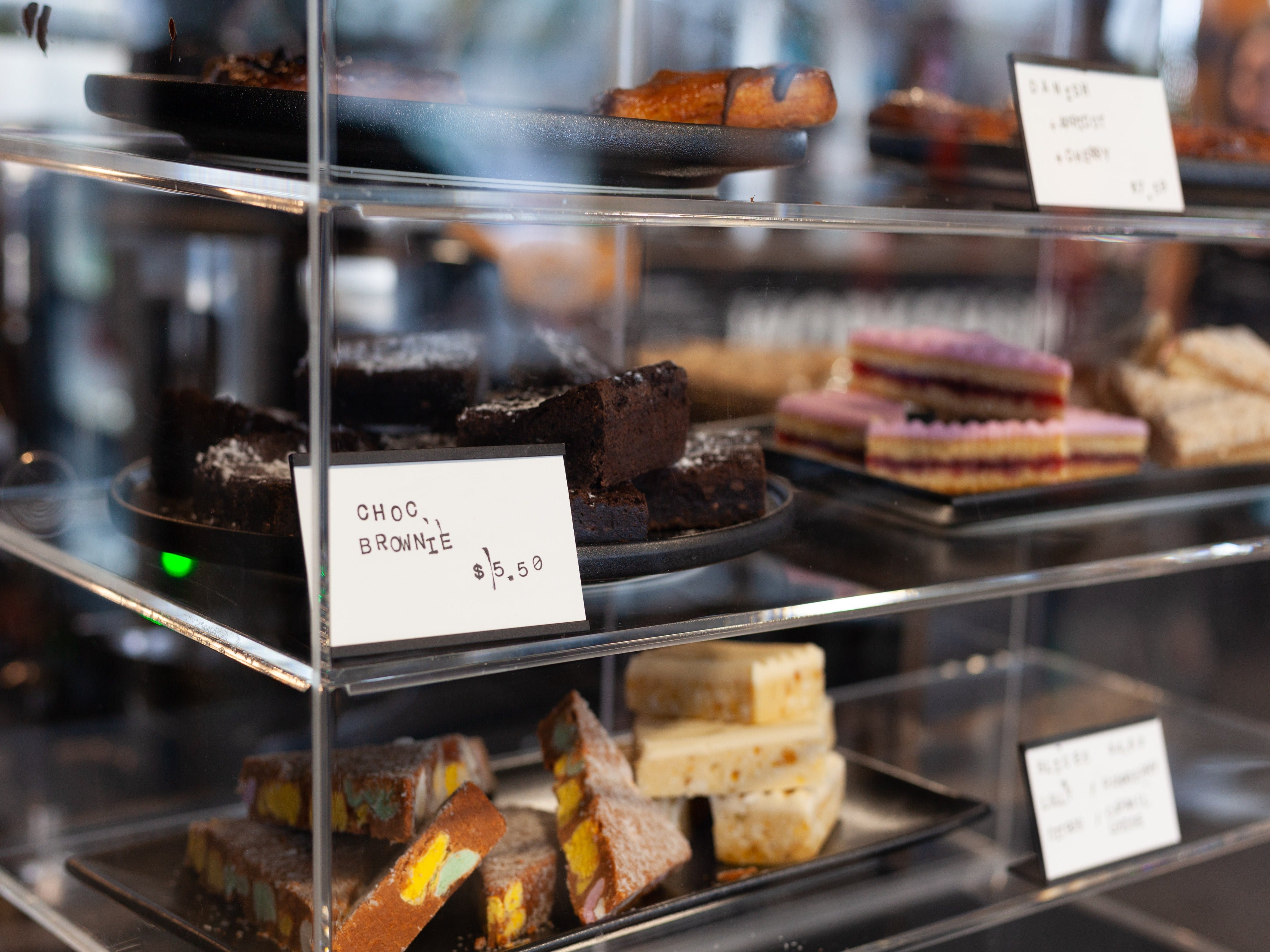 Variety of cakes in food cabinet