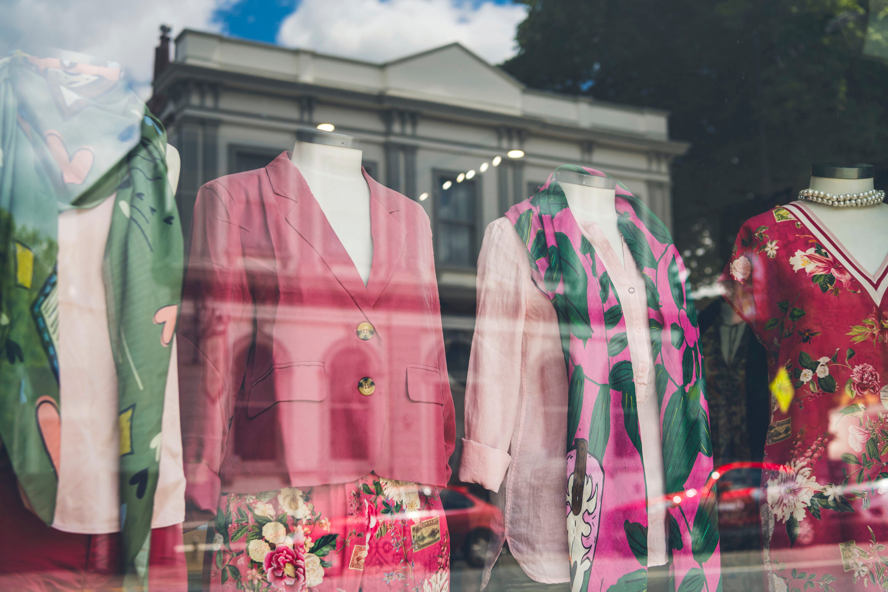 Clothes on mannequins in the shop window 