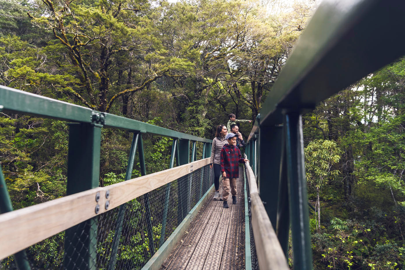 Family walking across the bridge 