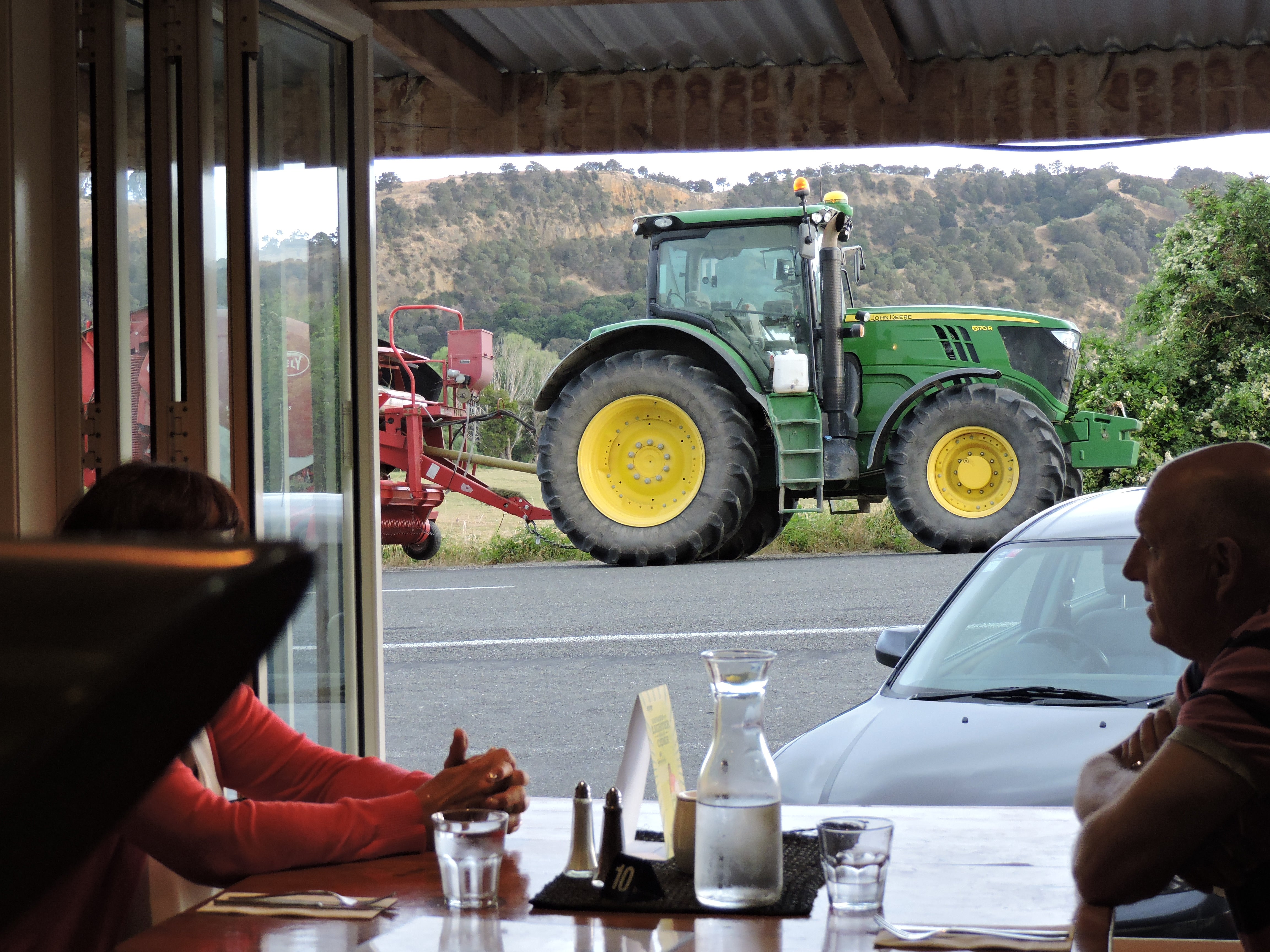 View through window of tractor parked outside 