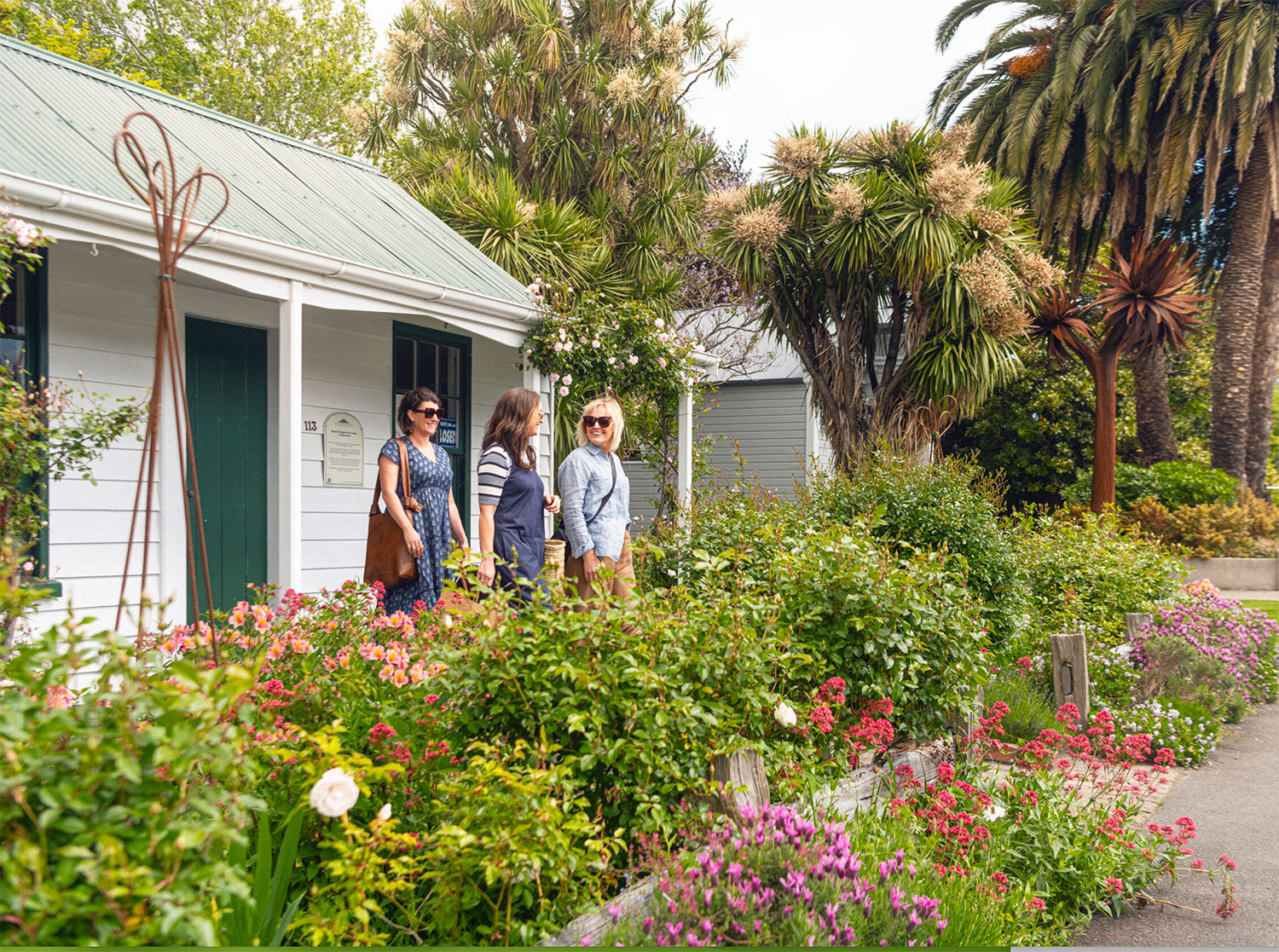 Ladies walking in cottage garden