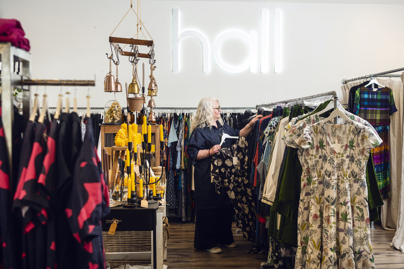 Looking through racks of clothes