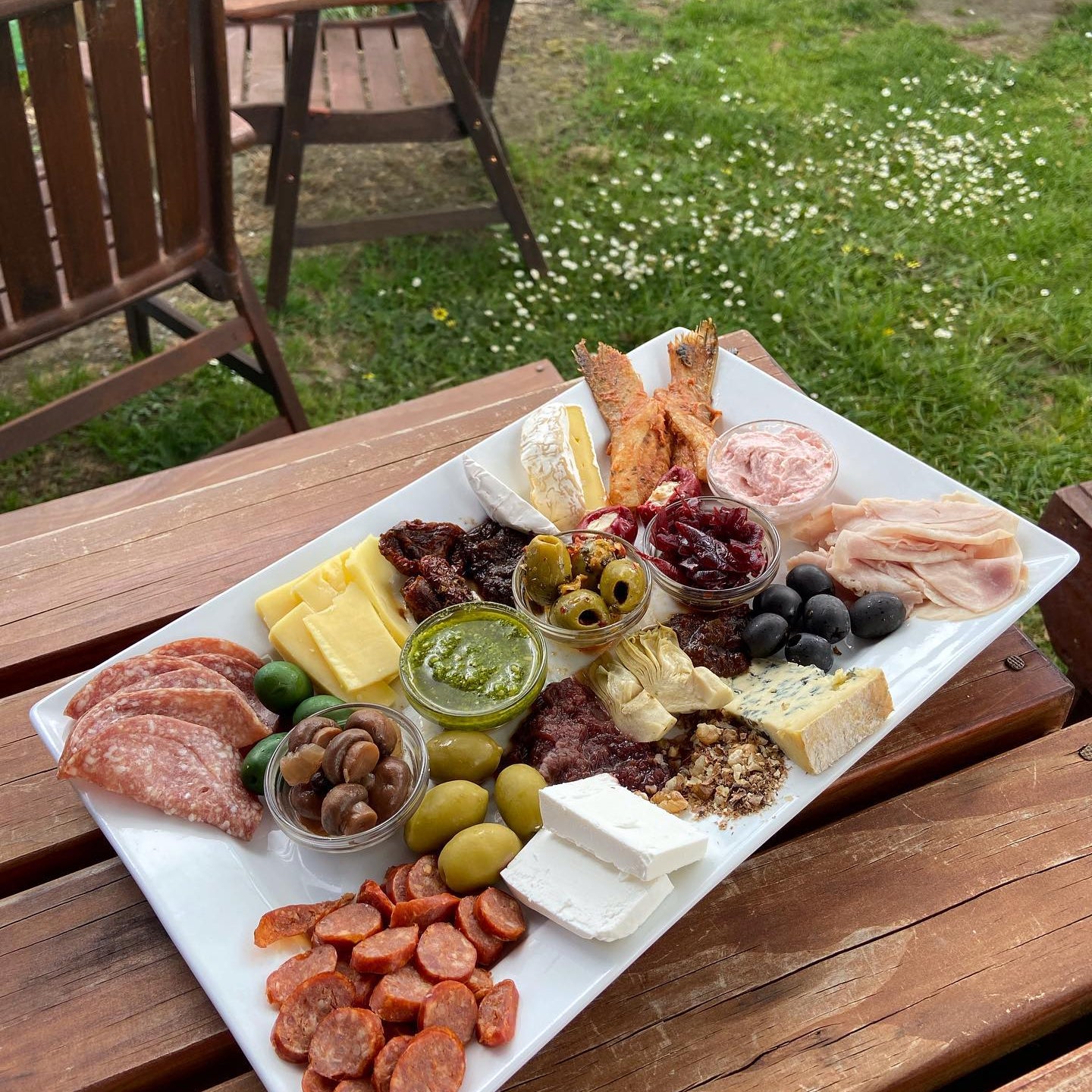 Platter of food on outdoor table 