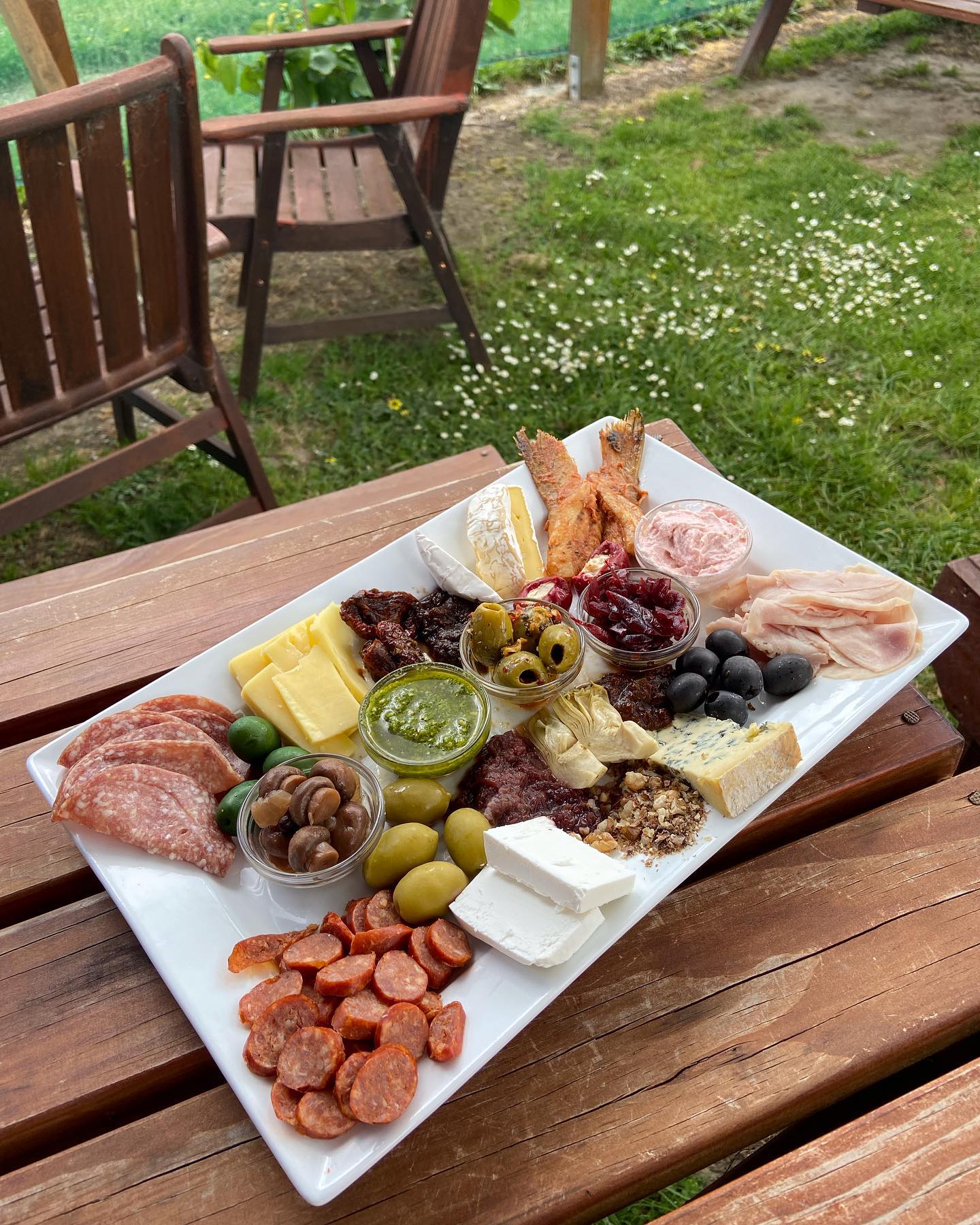 Platter of food on outdoor table 