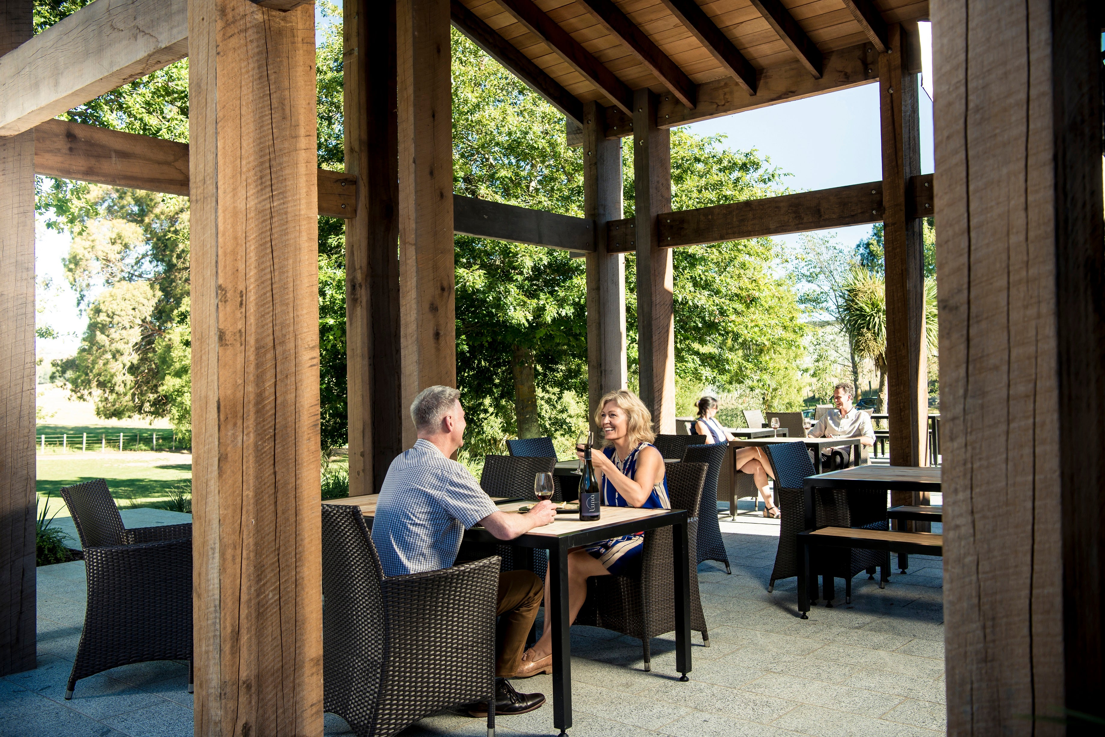 People drinking wine in the courtyard