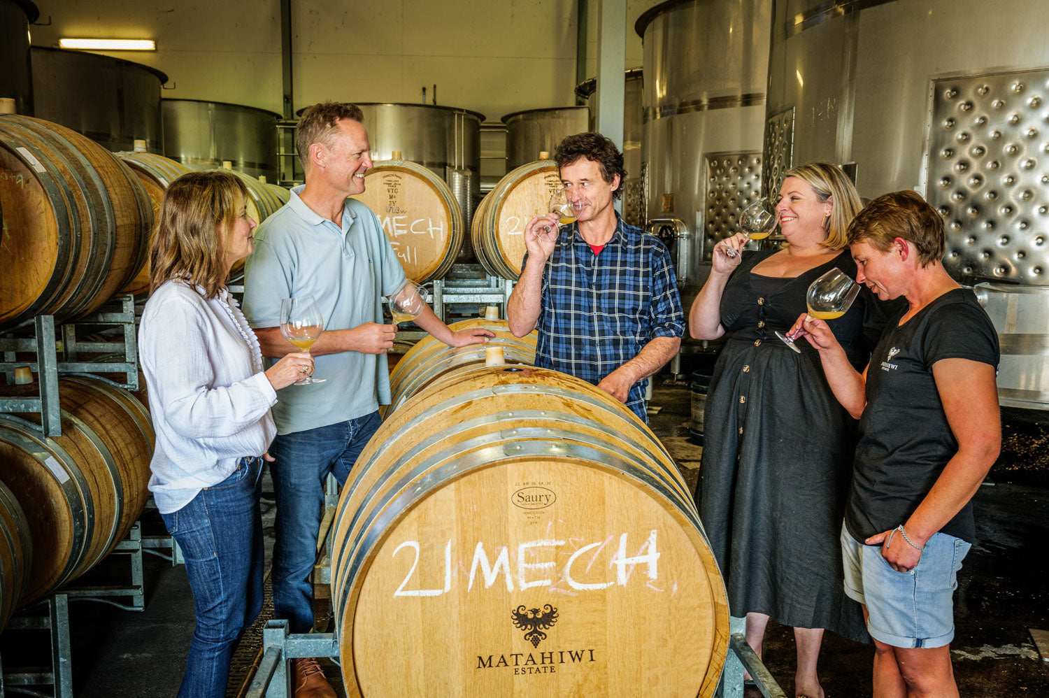 Winery staff tasting wine