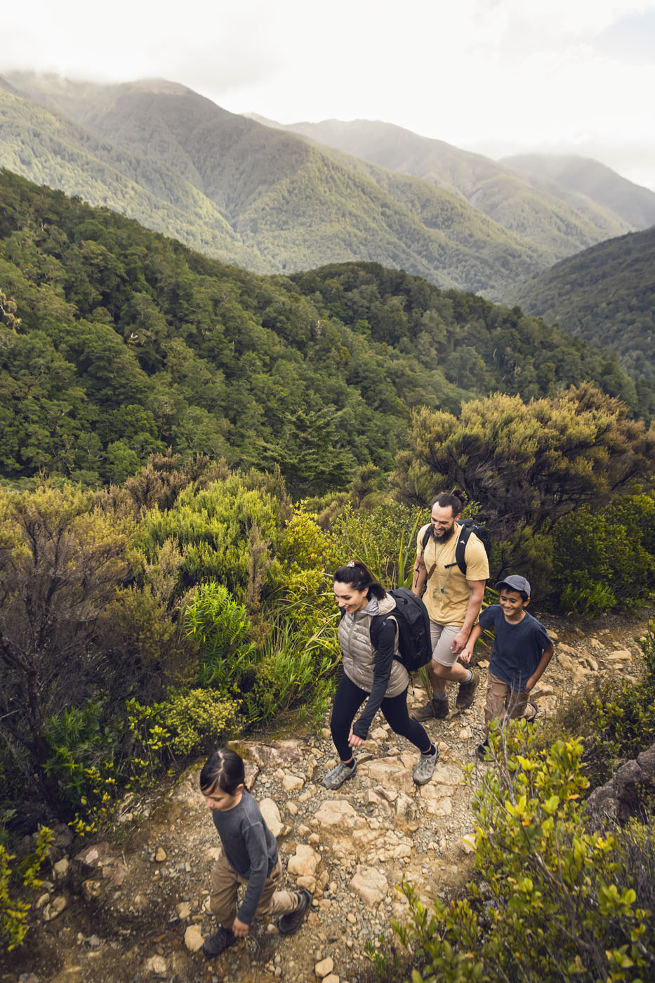 Family walking over hills 