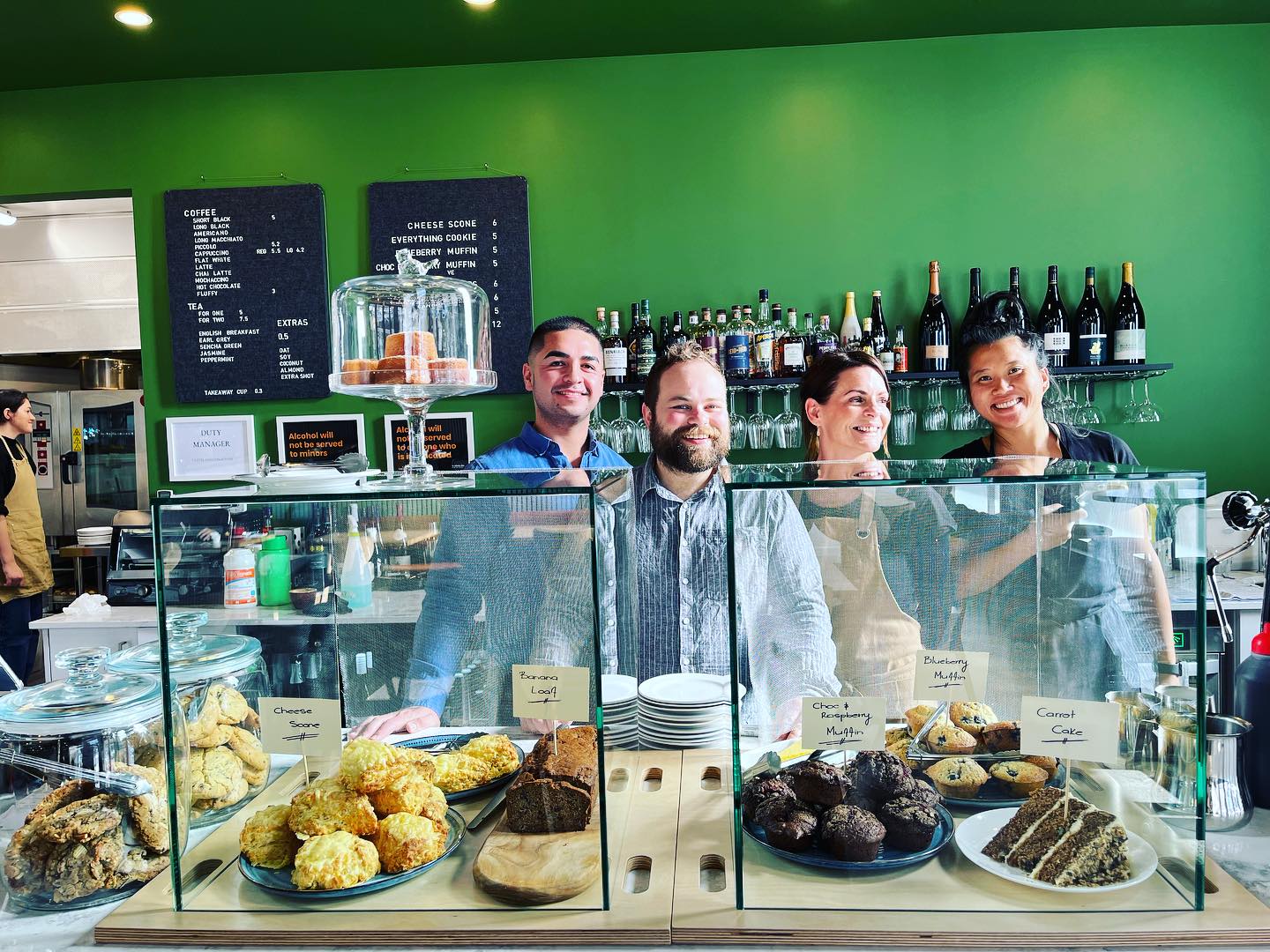 1.	People serving behind food cabinet