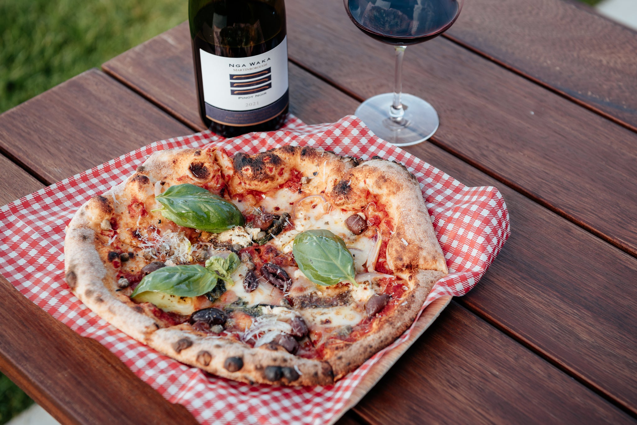 Handmade pizza on outdoor table 