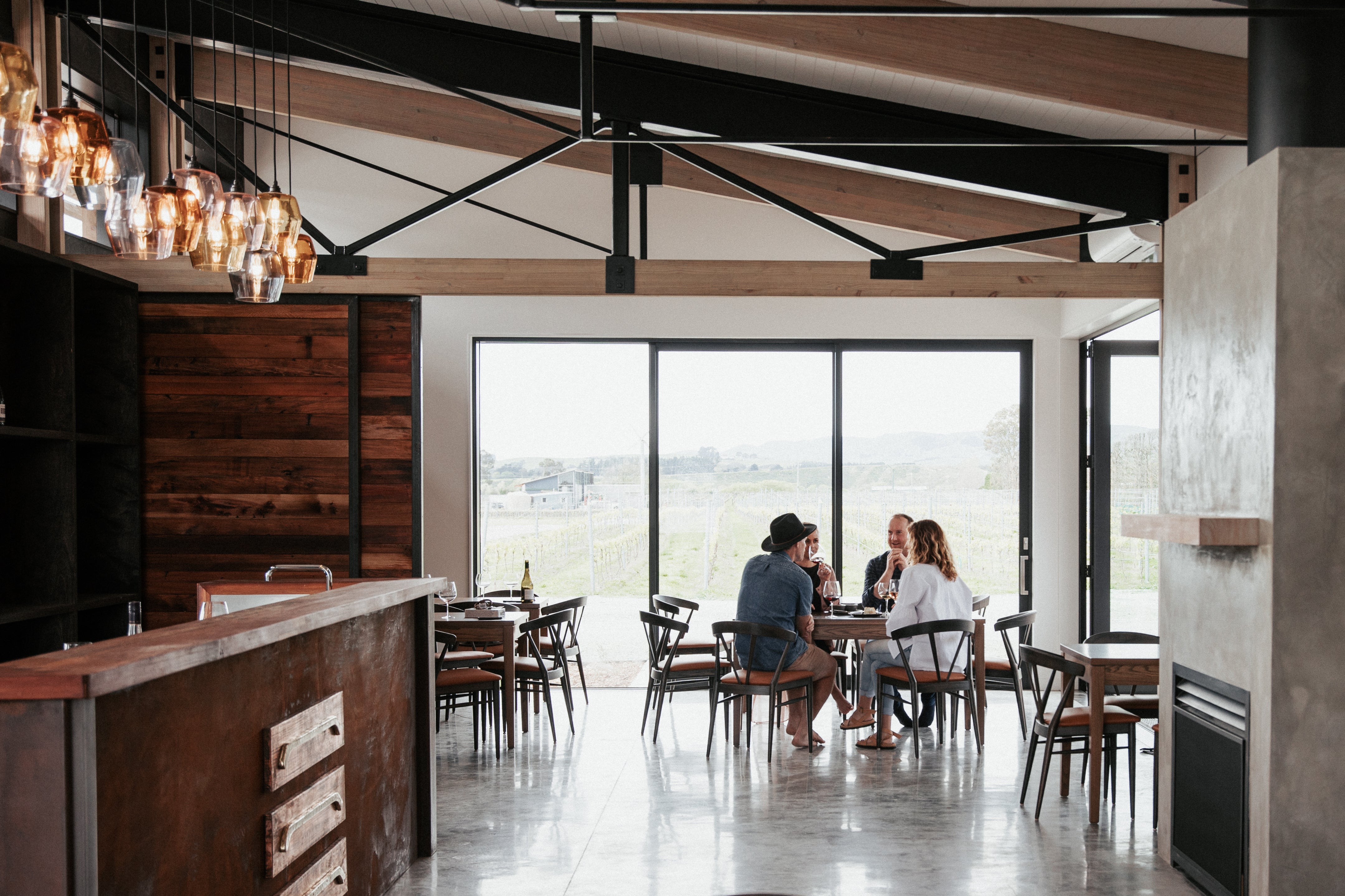 Group beside large window with views to vines 