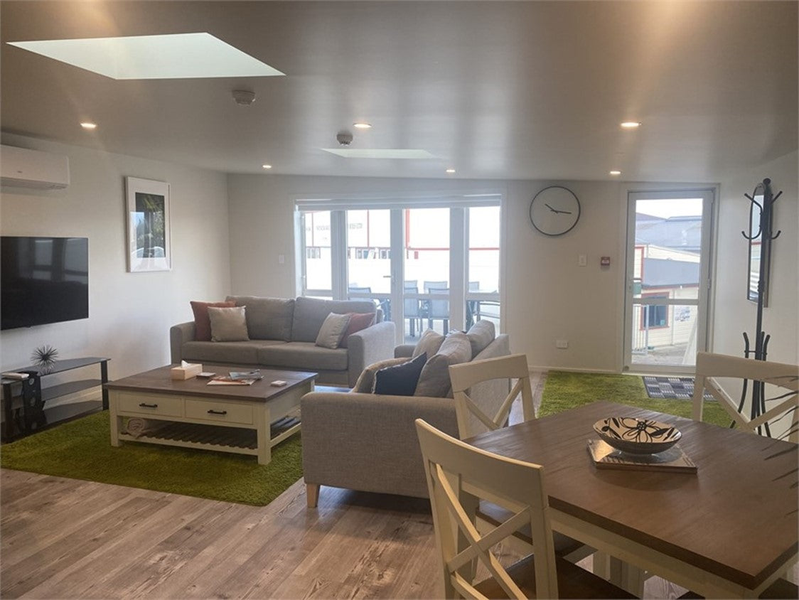 View from the kitchen to the doors leading to the deck.