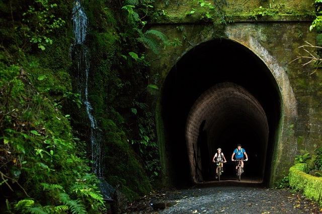 Cyclists exiting the old railway tunnel 