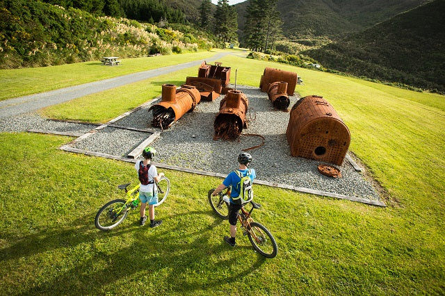 Cyclists at old railway ruins 