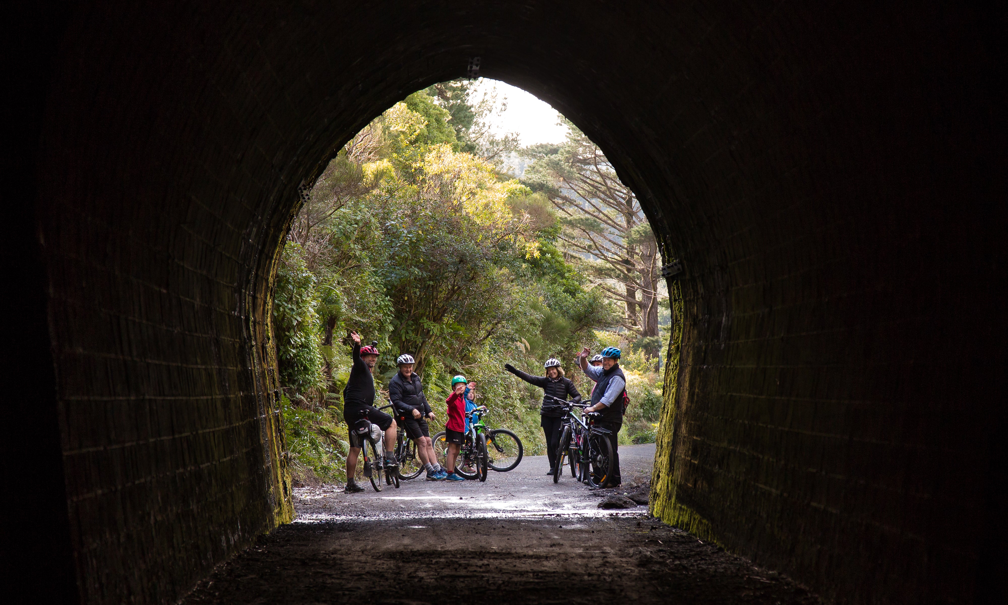 Cyclists exiting the old railway tunnel 