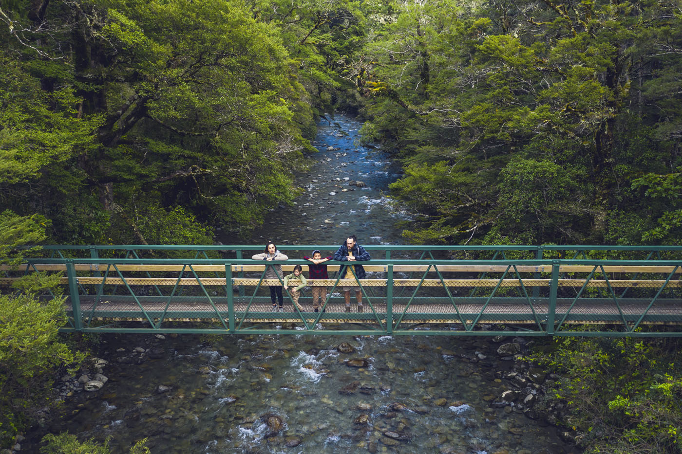 Family looking over bridge 