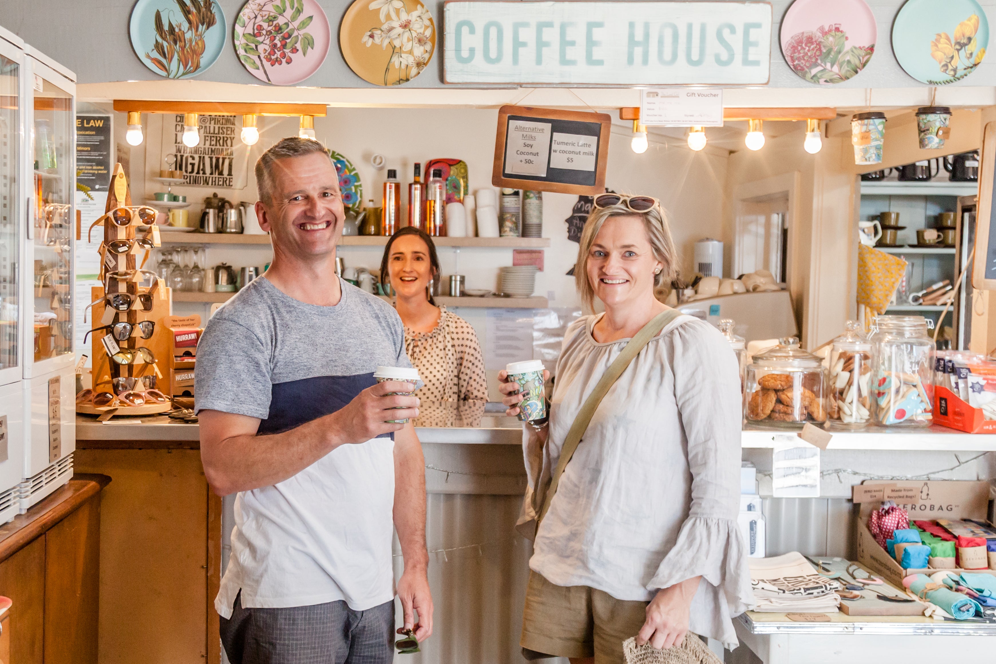 People with coffee inside shop 