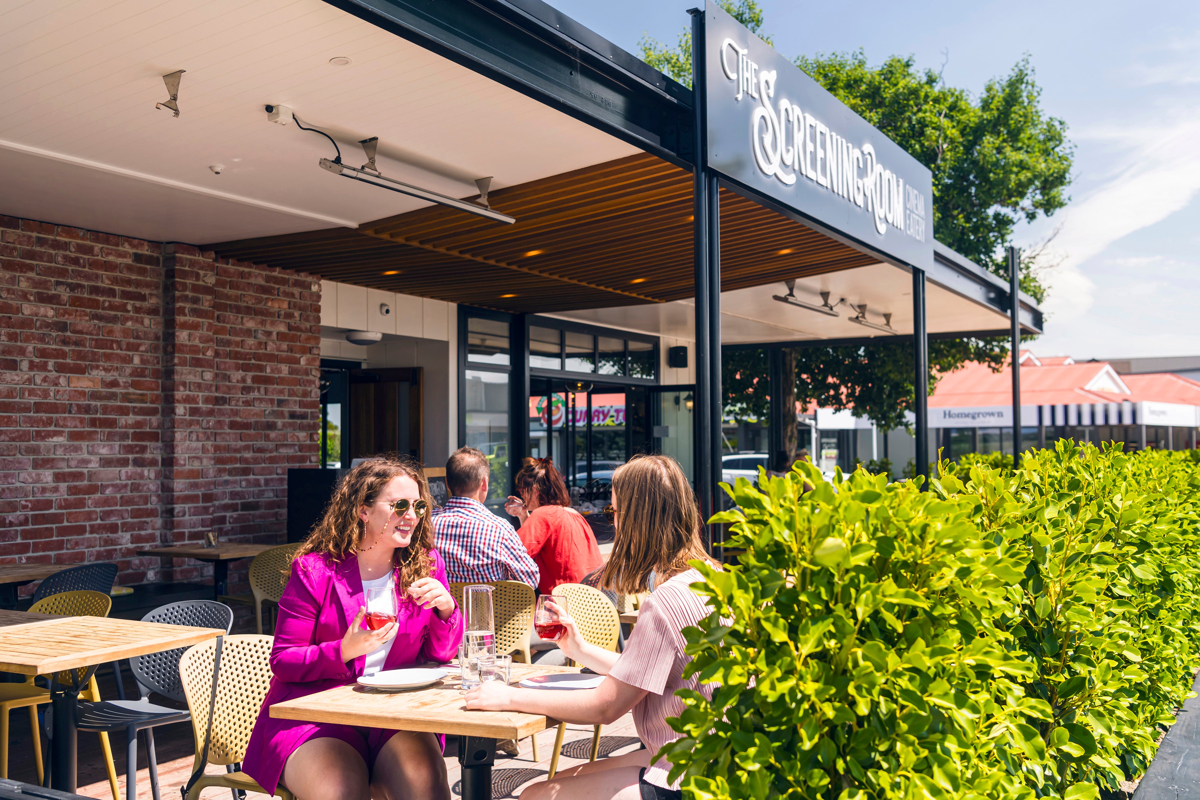 Ladies with drinks at outside table 