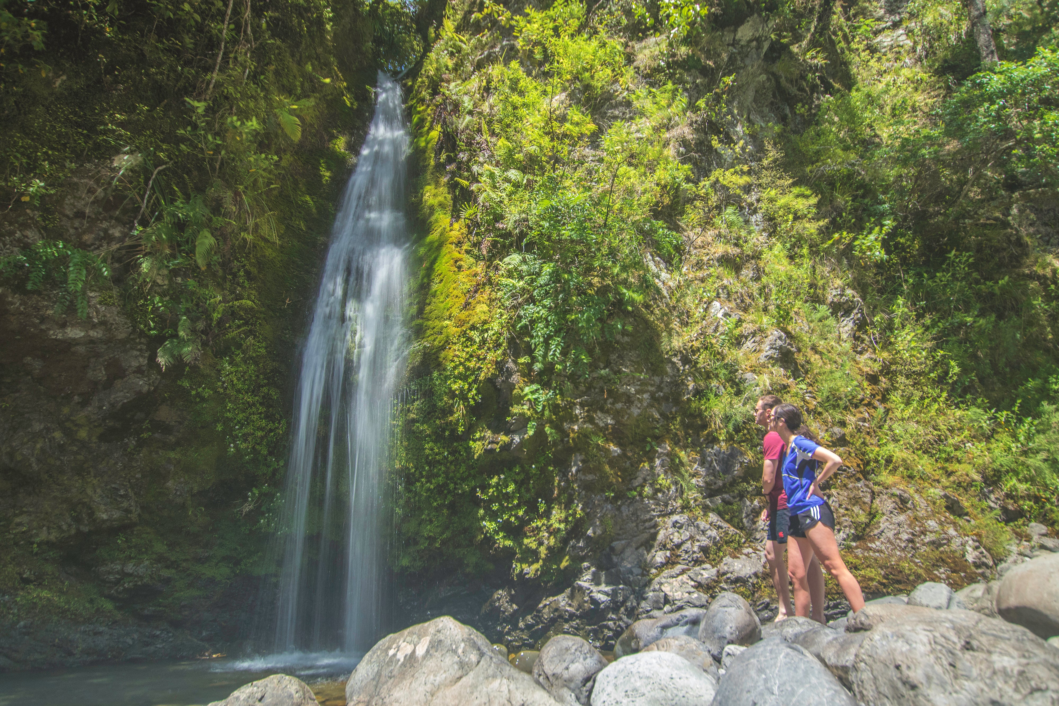 People looking at waterfall 