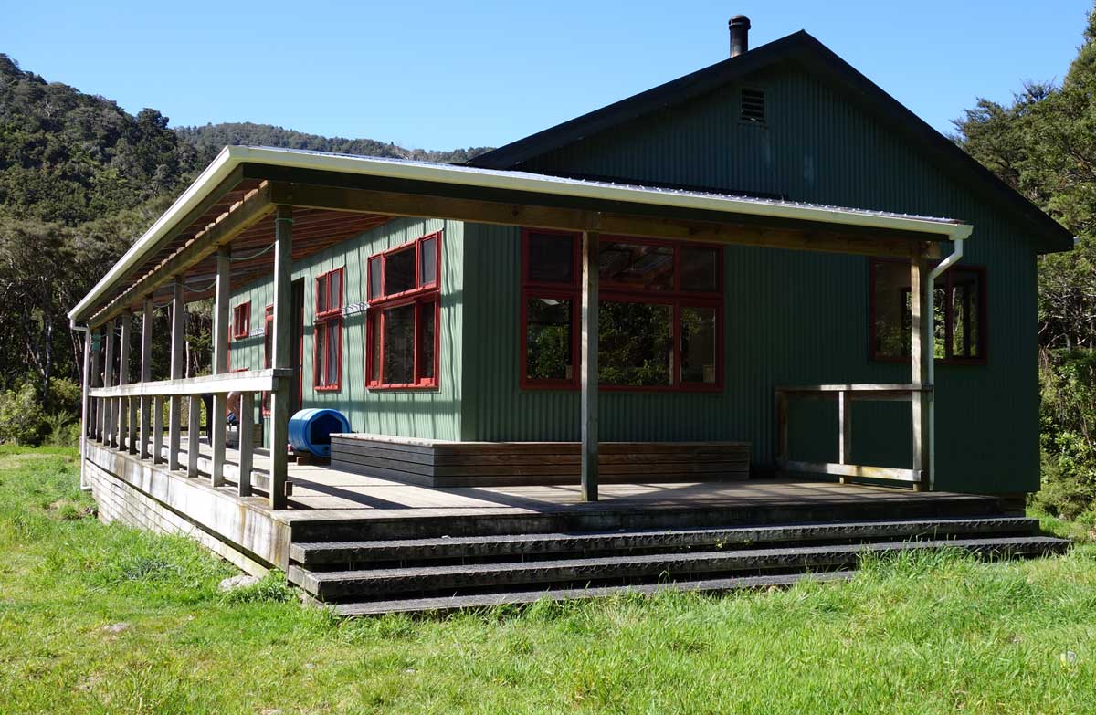 Tramping hut surrounded by bush 